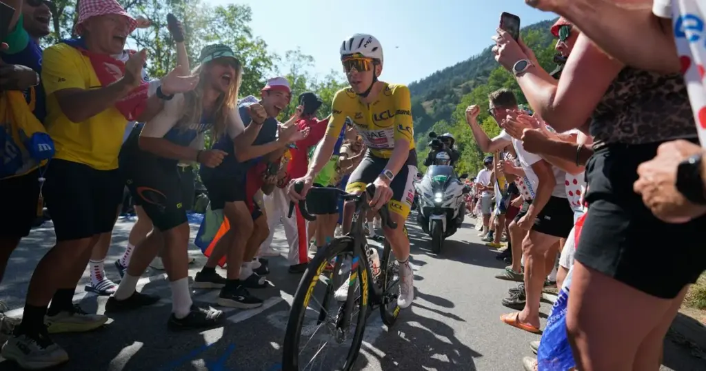 Pogacar conquers Alpe d'Huez in record climb to win stage 19 and extend Tour de France lead