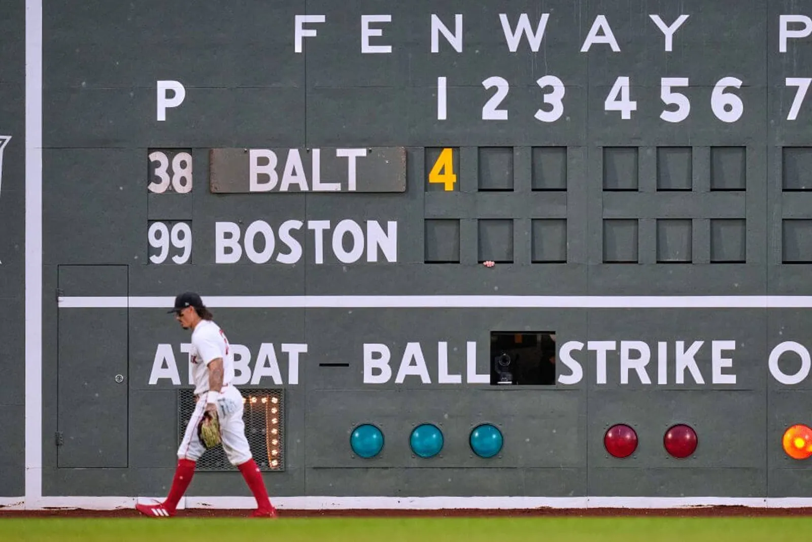 Jarren Duran walks by the scoreboard at Fenway Park.