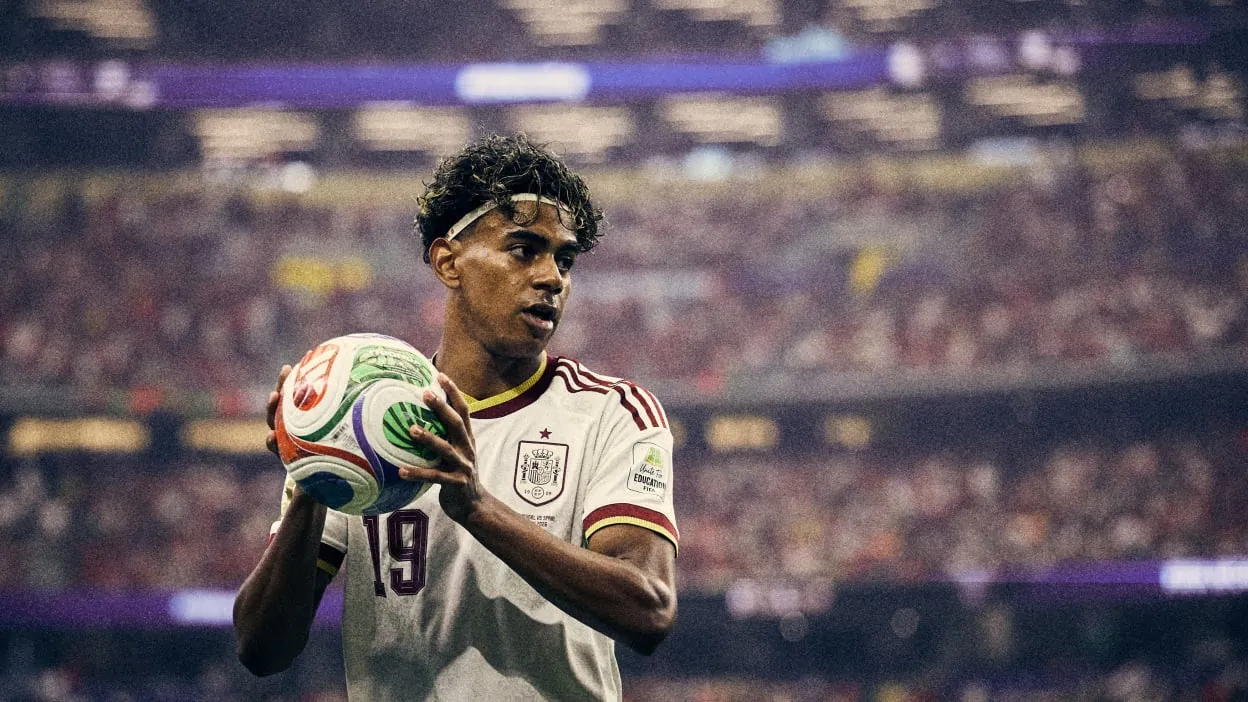 Lamine Yamal holds the ball