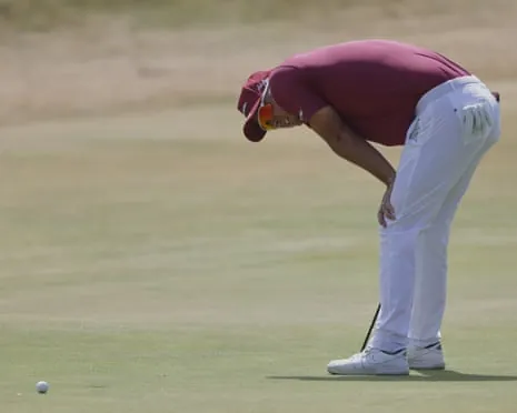Lucas Herbert watches as his putt for a record 61 slides past the hole