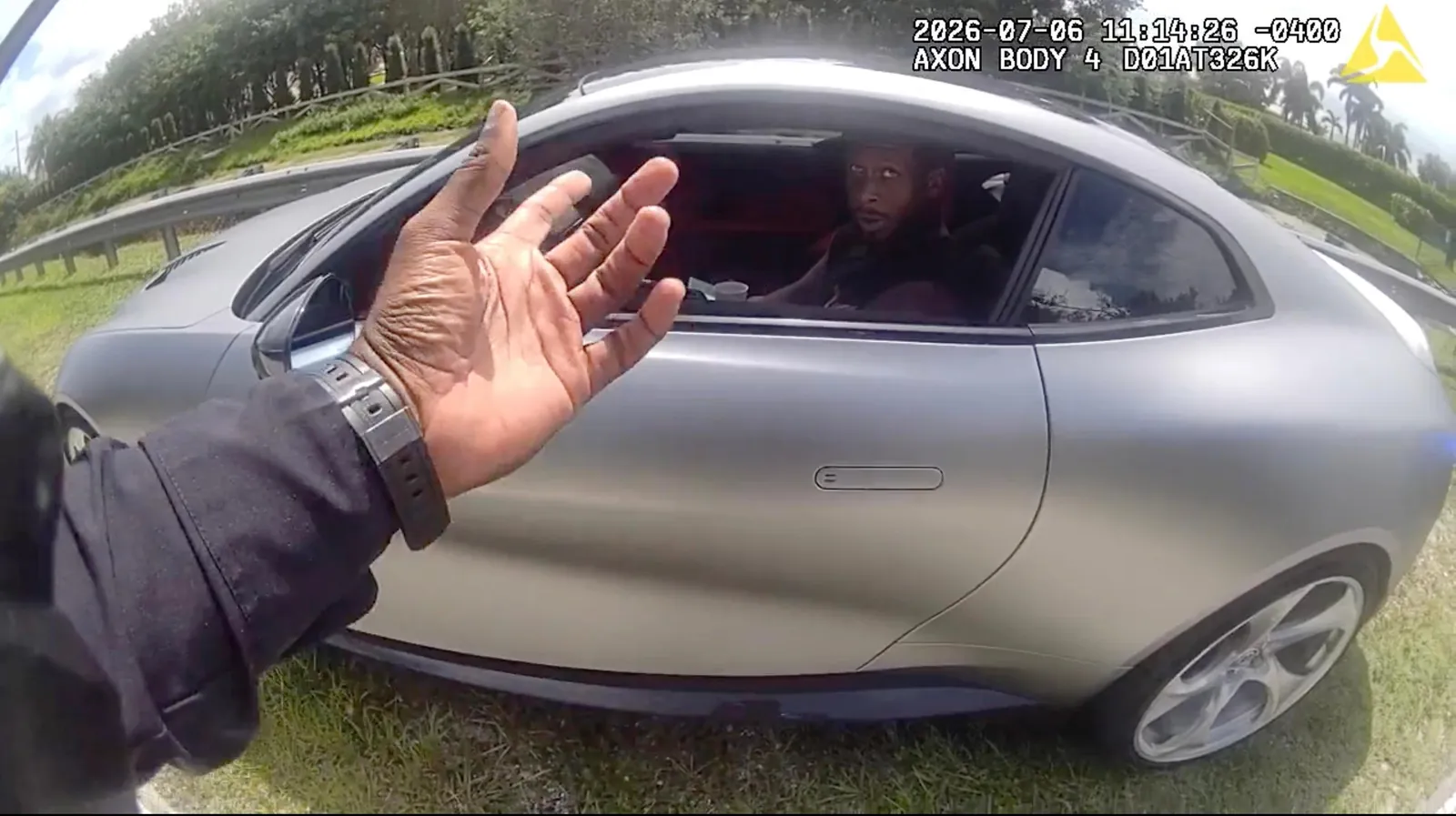Geno Smith in his car during a traffic stop.