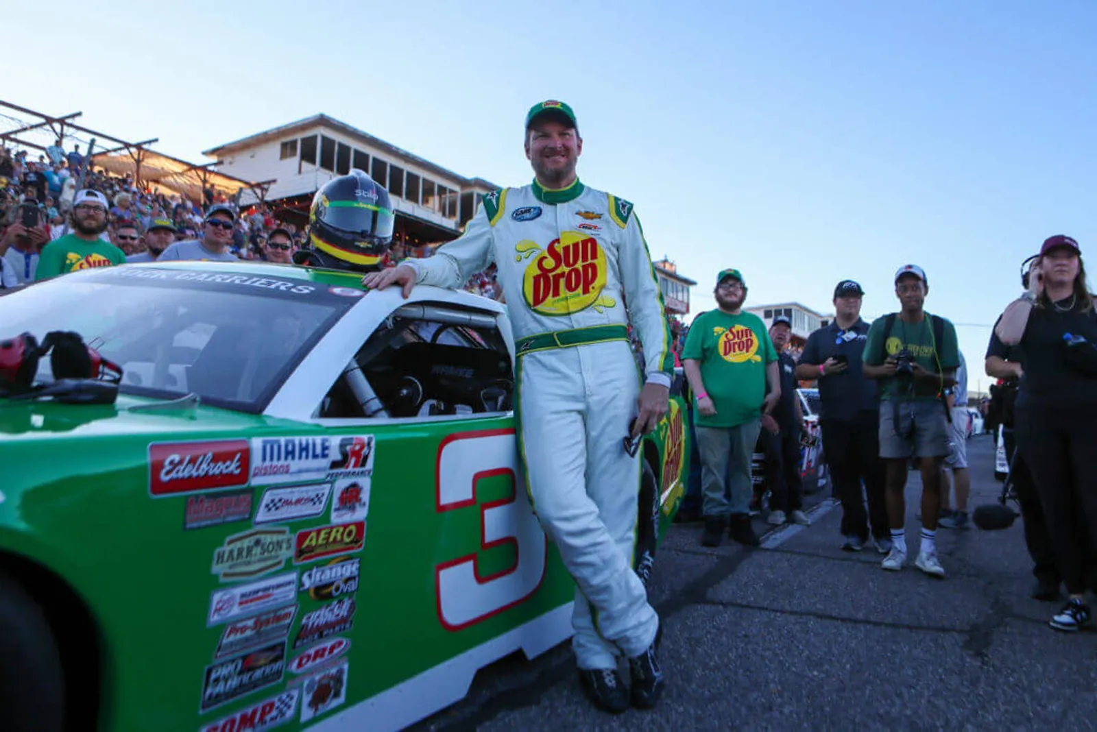 Dale Earnhardt Jr. stands next to his car on the starting grid moments before the Cars Tour LMSC 125 on Aug 31, 2022, at the North Wilkesboro Speedway.