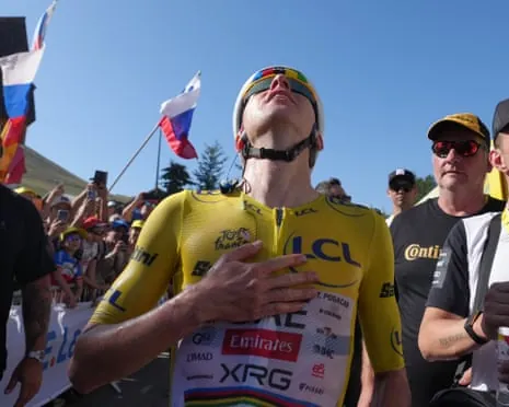 Slovenia's Tadej Pogacar looks to the sky after his incredible stage win on Alpe d’Huez.