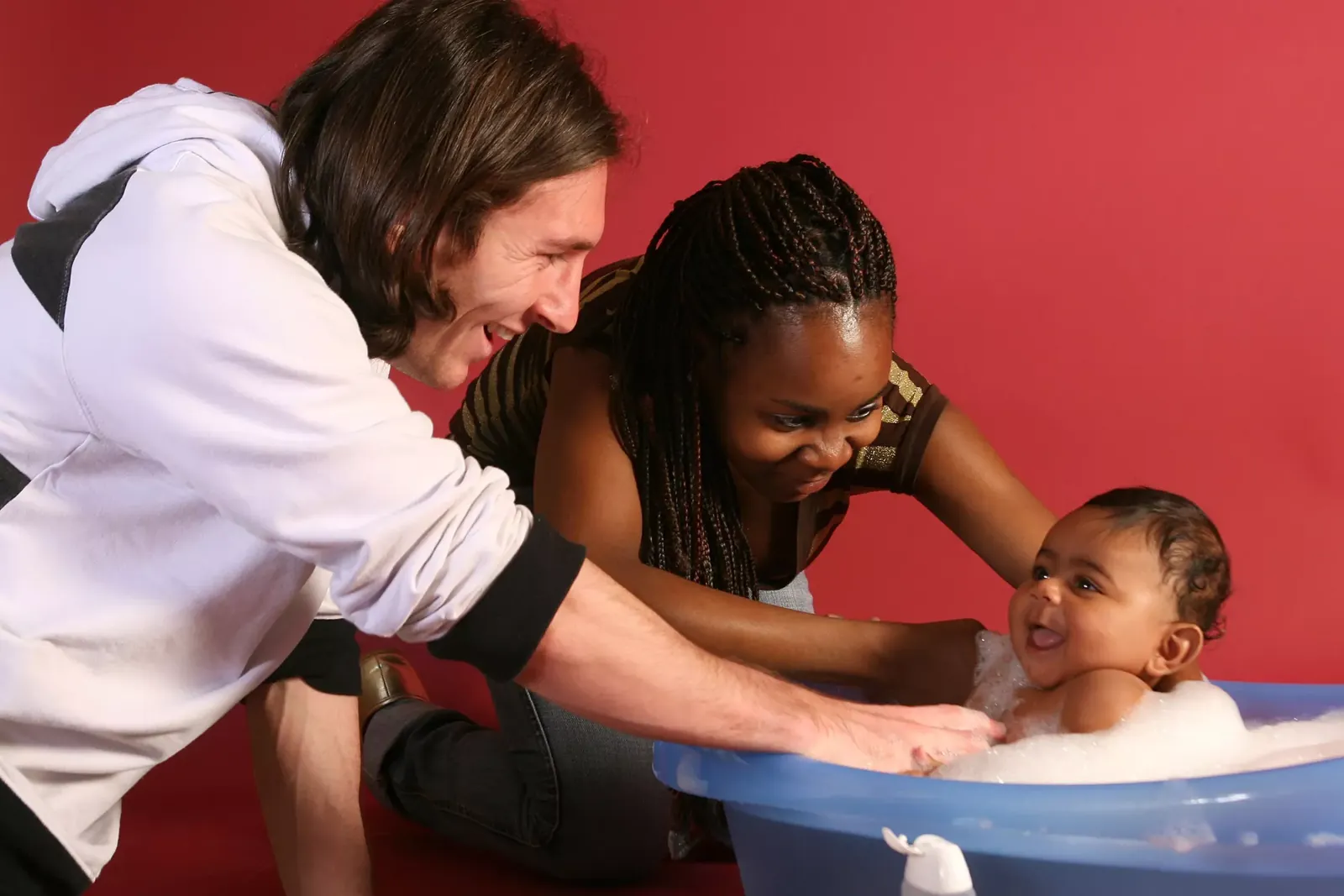 Lionel Messi helps to bathe Lamine Yamal, who was six months old at the time, with Yamal's mother, Sheila Ebana.
