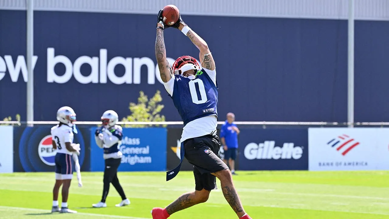 Jul 25, 2026; Foxborough, MA, USA; New England Patriots cornerback Christian Gonzalez (0) makes a catch at training camp at Gillette Stadium. Mandatory Credit: Eric Canha-Imagn Images