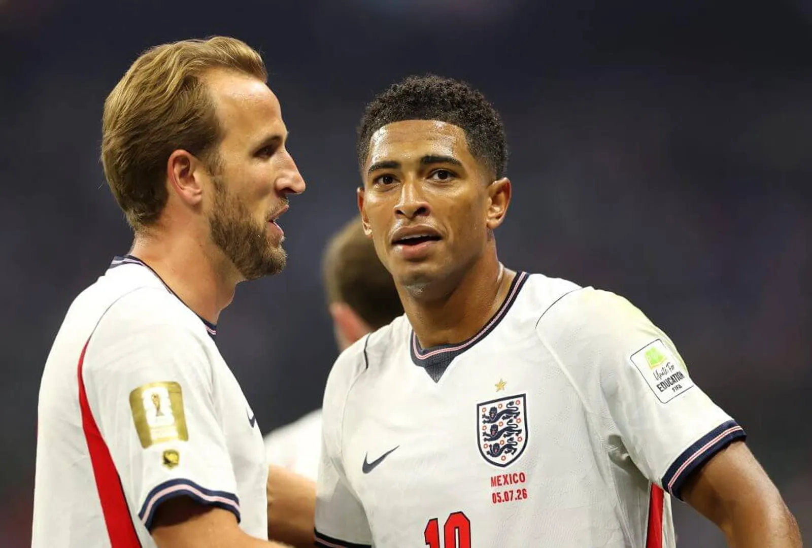 Harry Kane celebrates with Jude Bellingham after putting England 1-0 up against Mexico