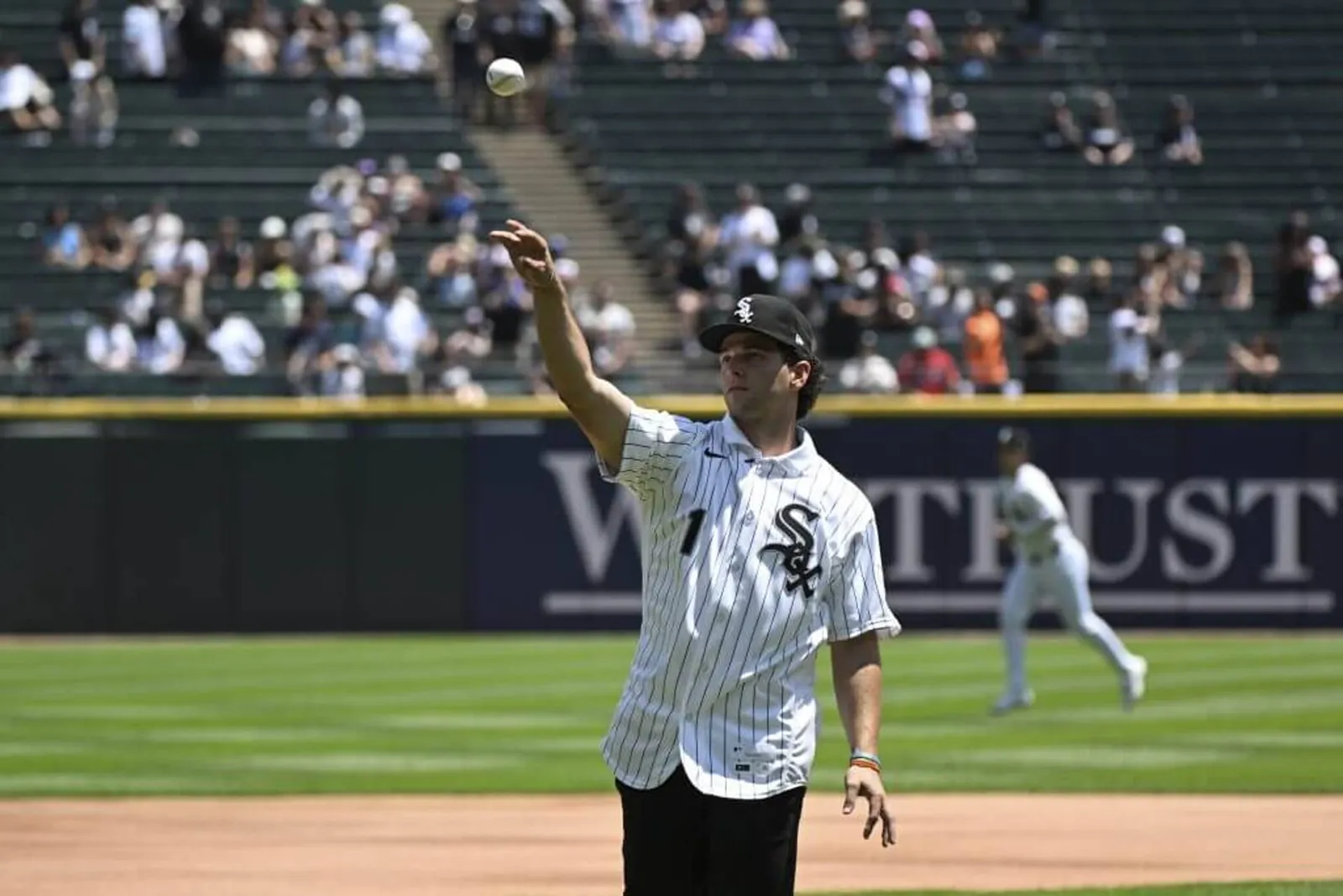Chicago White Sox number one draft pick Roch Cholowsky throws out a ceremonial first pitch at Rate Field the day after being drafted